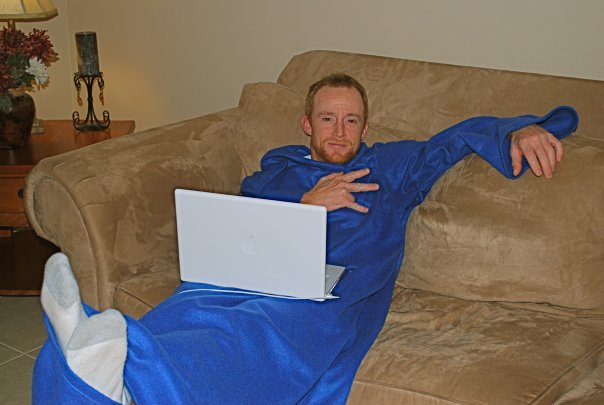 Jay flashing signs in his Snuggie.