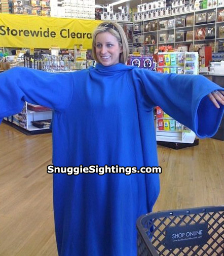 Snuggie Restless Arm Syndrome Strikes Sara. Unable to push her shopping cart. She smiles, nonetheless.